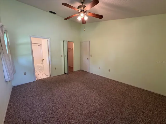 Primary bedroom with walk in closet.