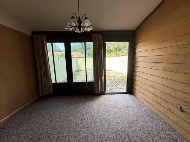 Florida Room that opens into the back courtyard.