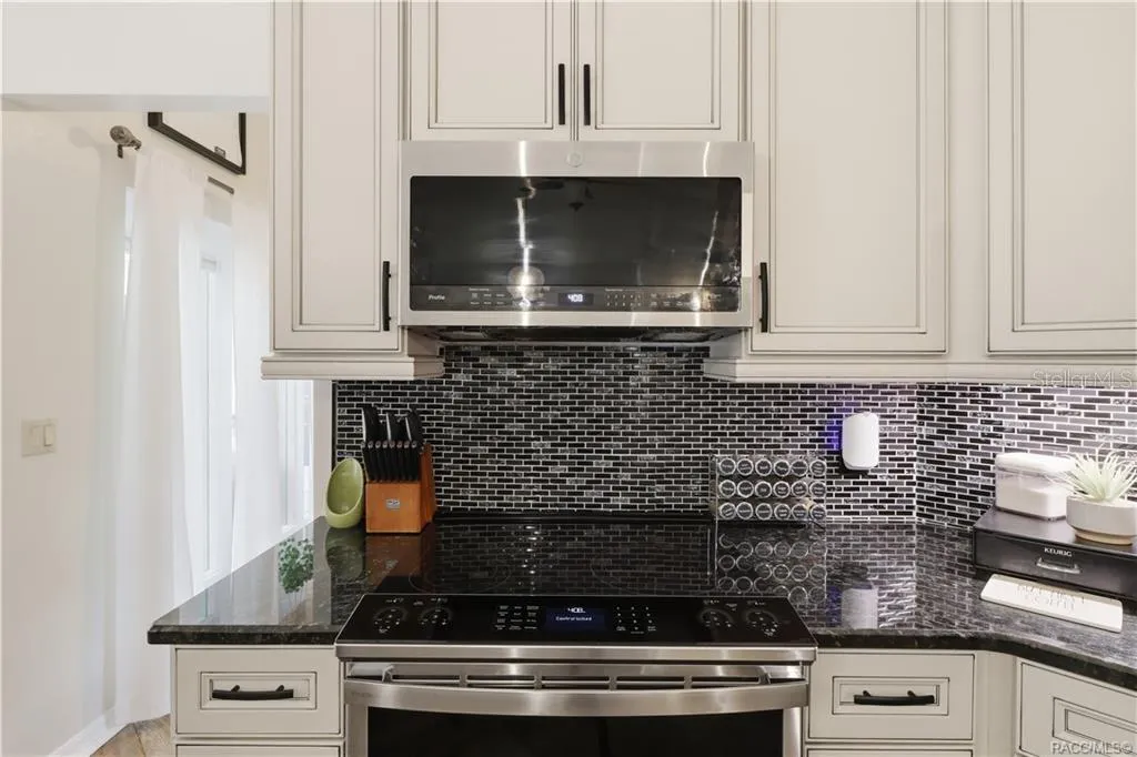CERAMIC TILE BACKSPLASH- Close-up of the decorative black, gray & white CERAMIC MOSAIC TILE BACKSPLASH featuring a horizontal brick-pattern layout.
