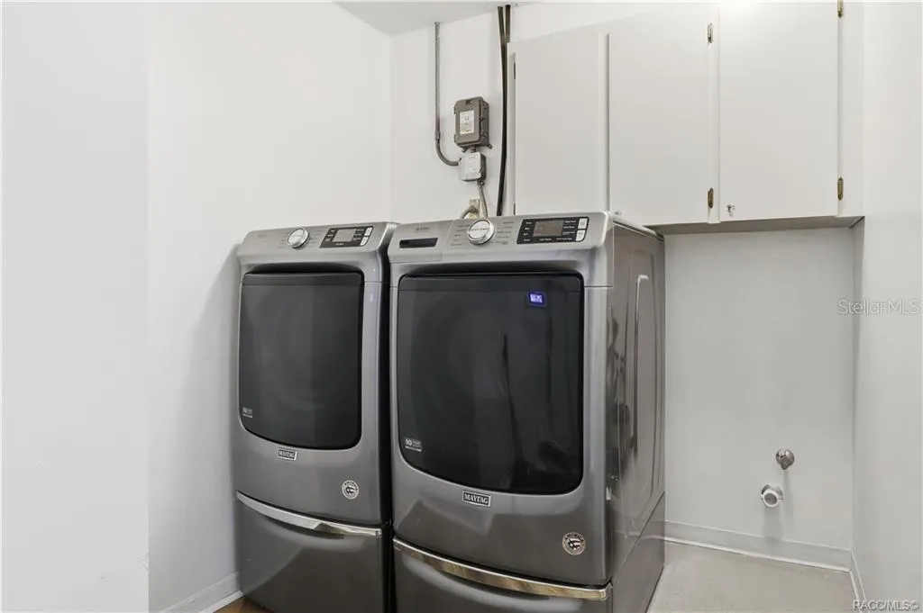 Indoor Laundry Room – Convenient indoor laundry room w/washer, dryer & overhead cabinetry for additional storage.