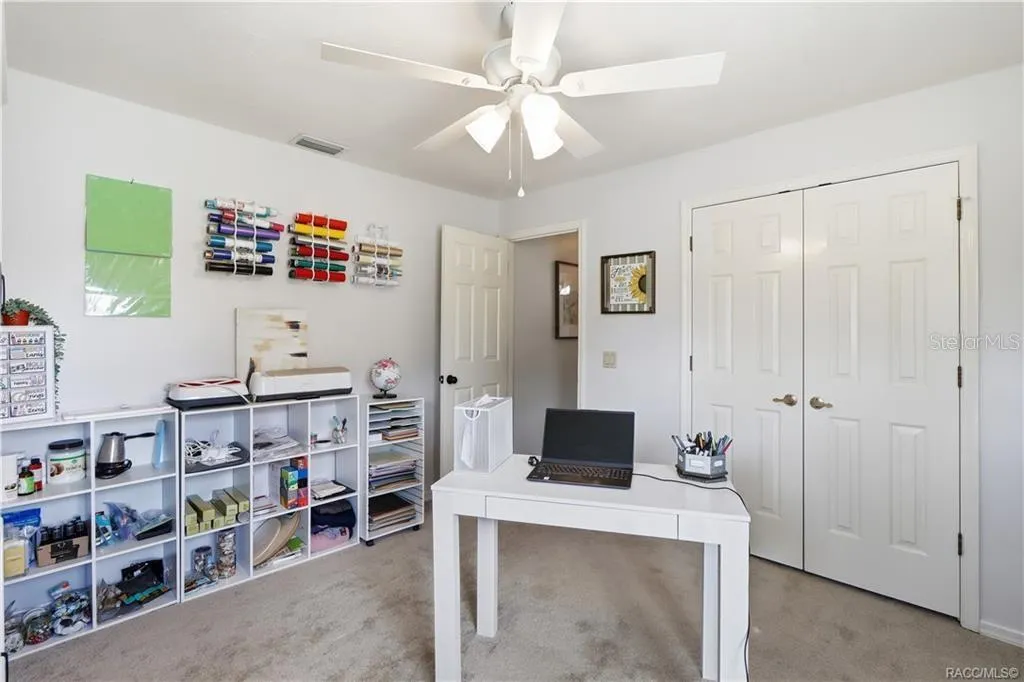 Versatile Bedroom or Home Office – Light-filled room featuring two windows, ceiling fan & comfortable space for a home office, guest bedroom or hobby room.