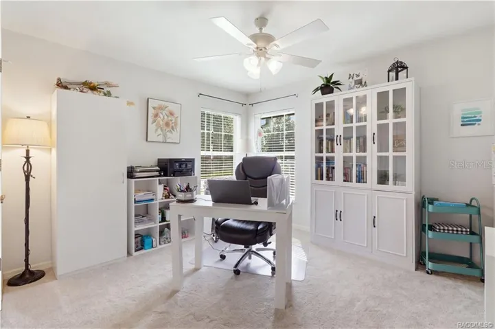 Versatile Bedroom or Home Office – Light-filled room featuring two windows, ceiling fan & comfortable space for a home office, guest bedroom or hobby room.