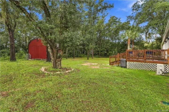 Spacious Backyard – Enjoy the natural setting w/mature shade trees, green lawn, wooden rear deck &amp; detached storage building. Plenty of outdoor space to enjoy!