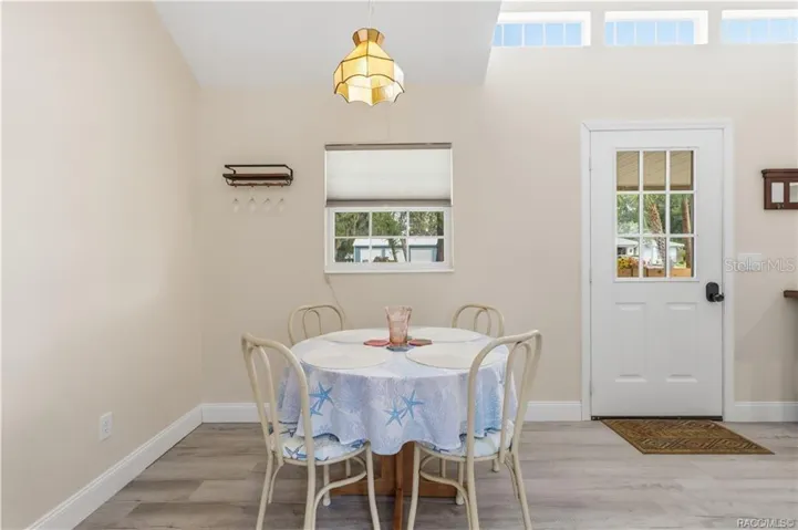 Dining Area – Comfortable dining space w/natural light, vaulted ceiling &amp; convenient access to the kitchen &amp; living area.