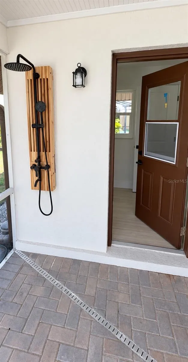Outdoor shower beside the pool area