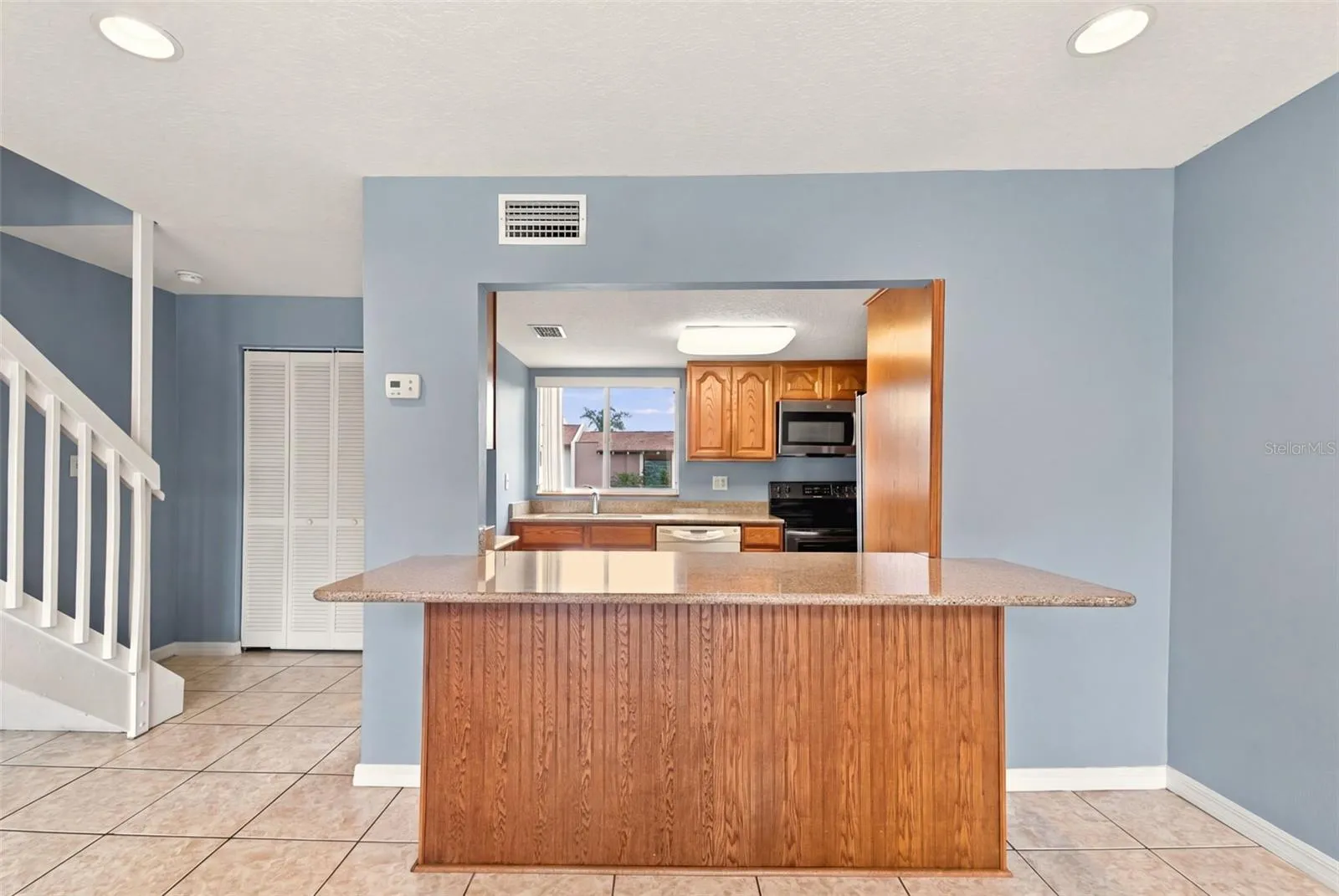 Breakfast bar with stone countertop