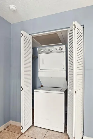 Laundry closet off kitchen with washer/dryer