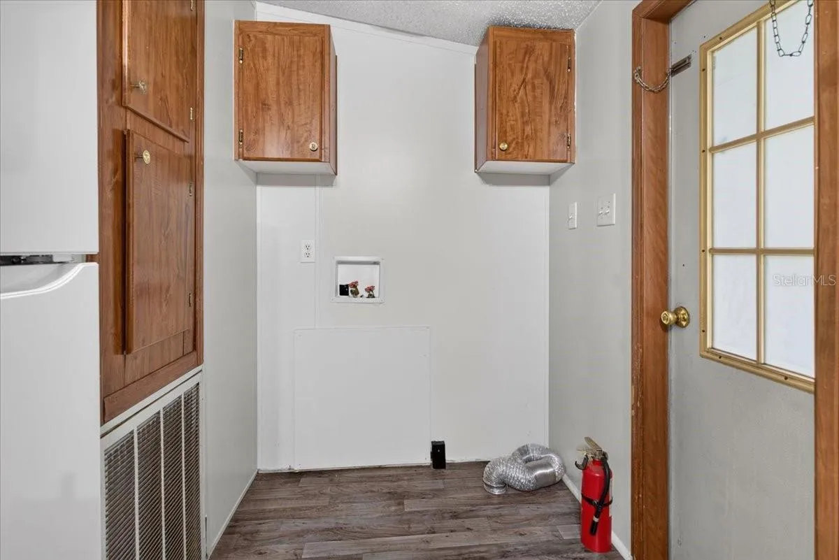 Utility area with overhead cabinets for even more storage space