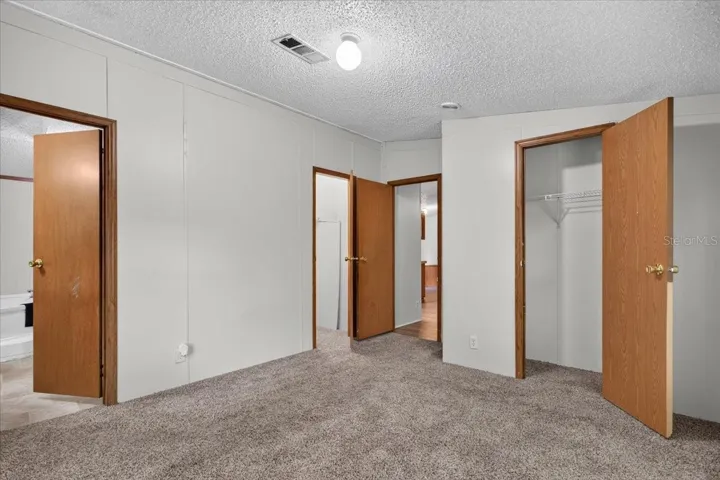 Primary Bedroom with two separate walk-in closets!