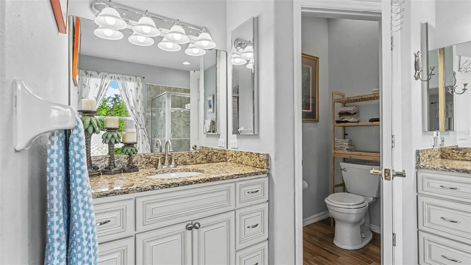 Beautiful remodeled ensuite bathroom with soaking tub, walk-in shower, double vanities, and private toilet room
