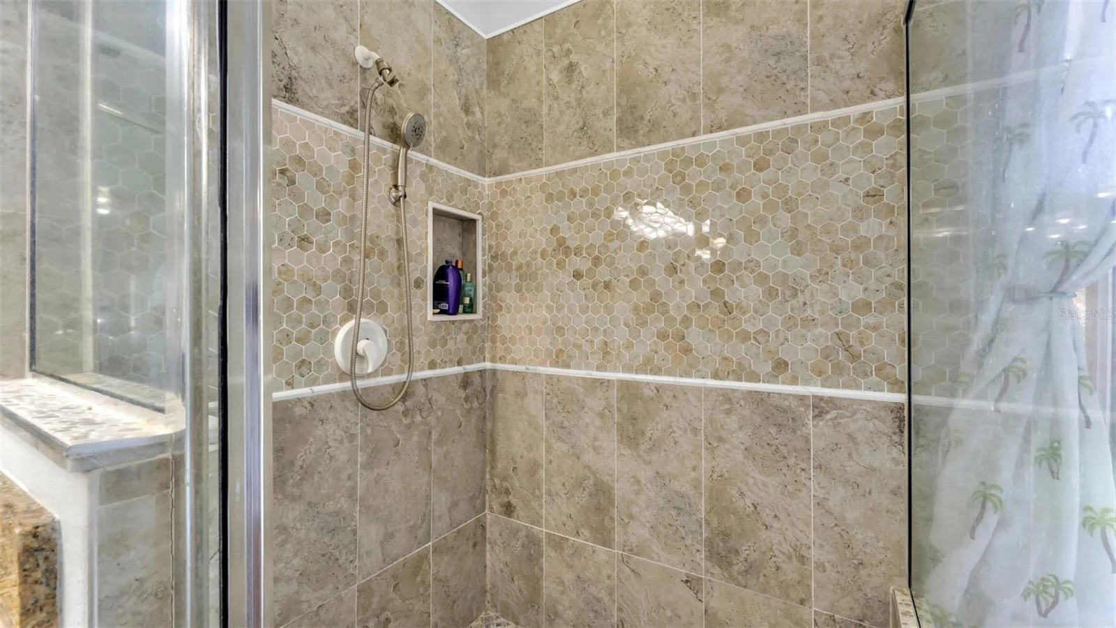 Beautiful remodeled ensuite bathroom with soaking tub, walk-in shower, double vanities, and private toilet room