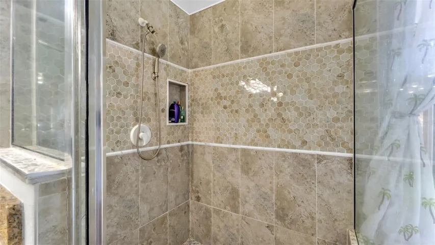 Beautiful remodeled ensuite bathroom with soaking tub, walk-in shower, double vanities, and private toilet room