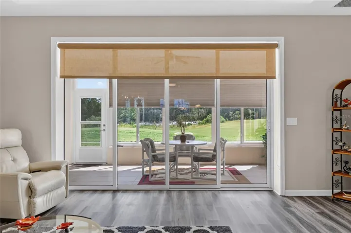 Wall of Sliding Glass Doors onto Enclosed Lanai