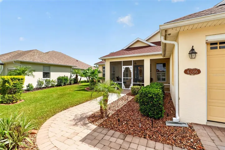 Paved walkway to screened front porch