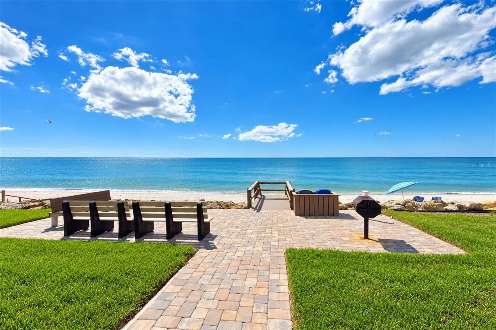 Grilling area with steps to the beach.