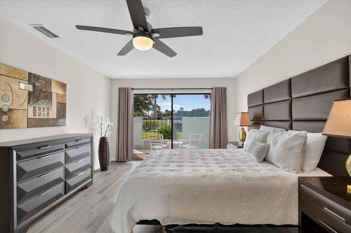 master bedroom with sliders to the patio