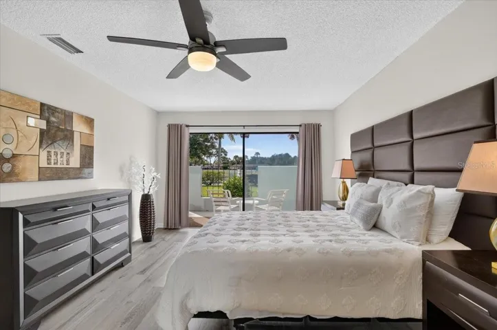 master bedroom with sliders to the patio