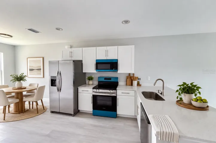 Virtually staged - kitchen and dining area.