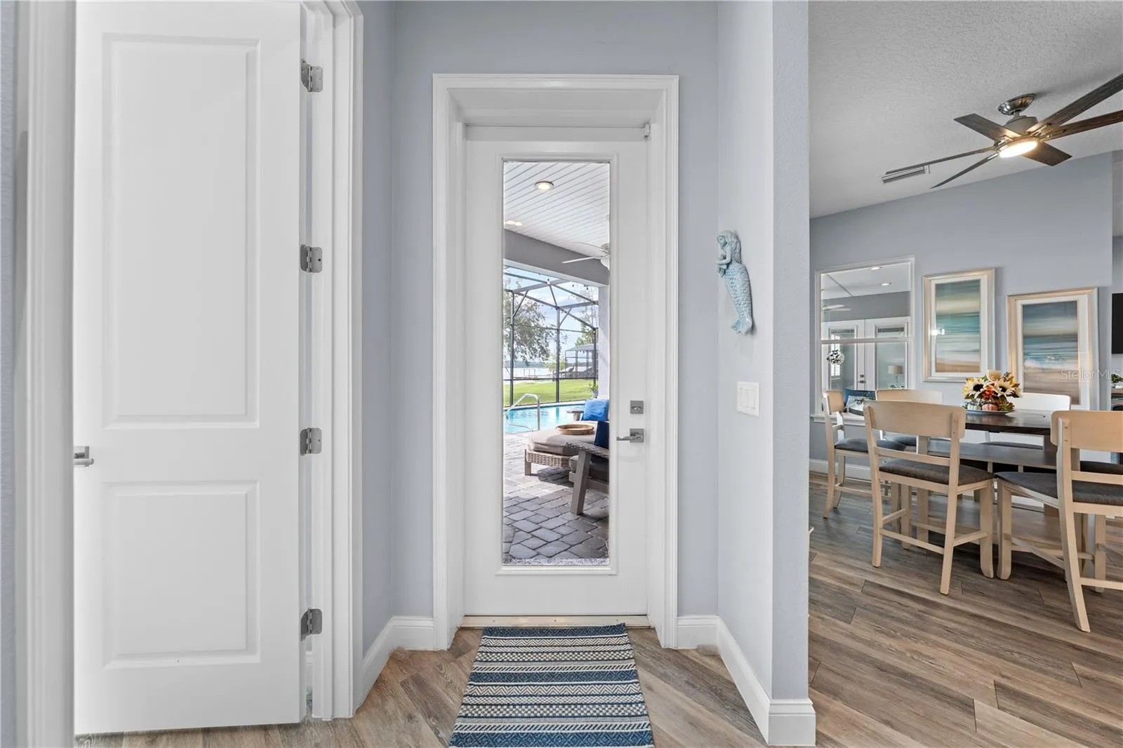 Door leading to the lanai from the 2nd primary bedroom area and just off the kitchen/dinette.