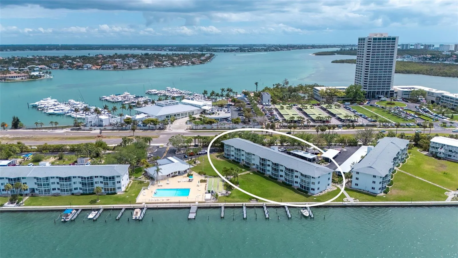 Aerial shot of exterior building. Sarasota Yacht Club directly across the street.