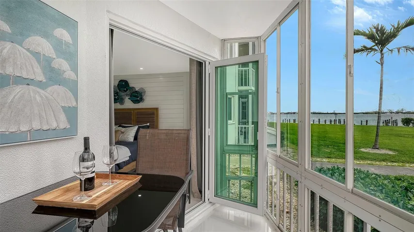 Bi-fold high impact sliding glass doors.