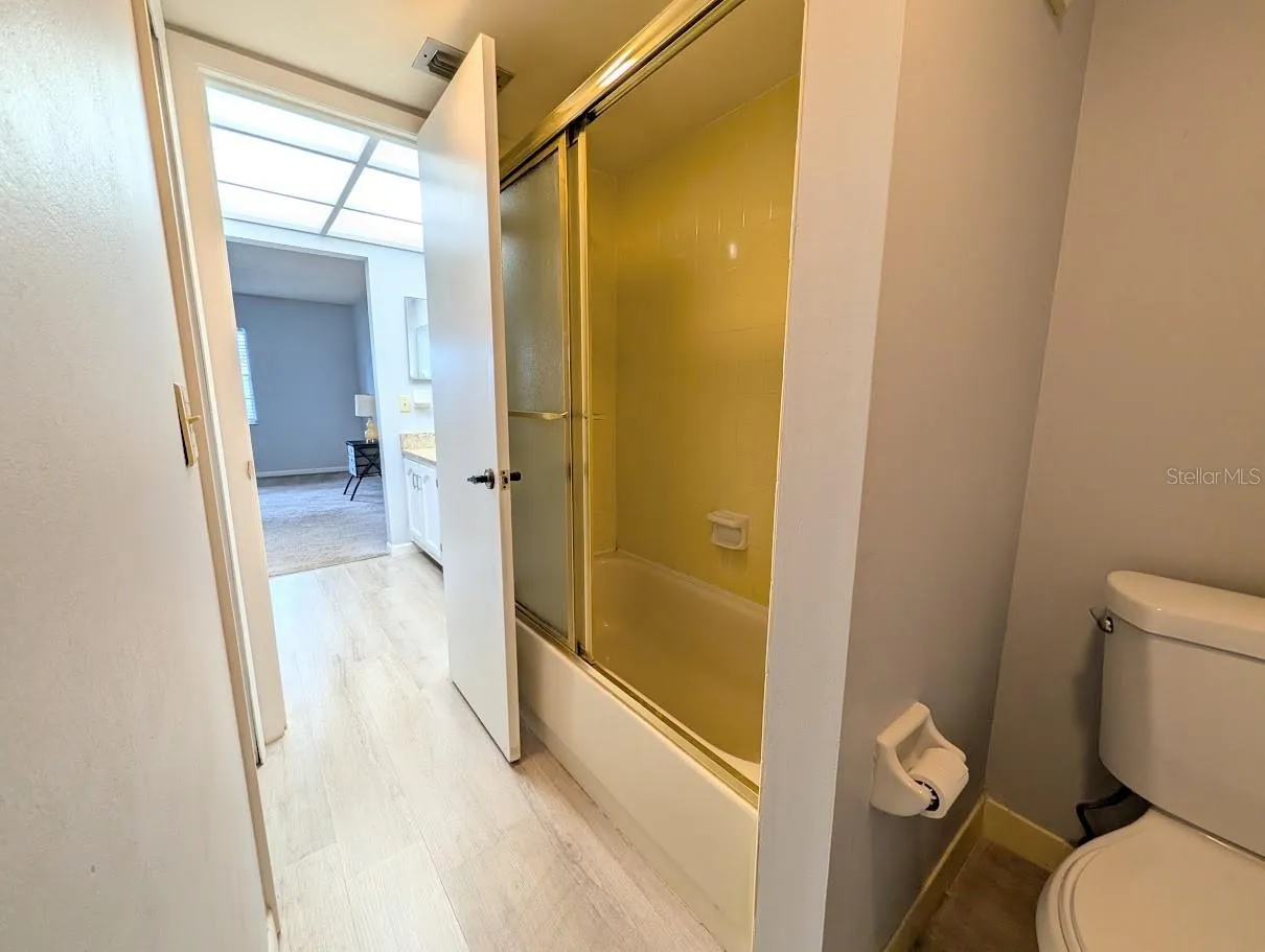 Primary bath area with tub shower