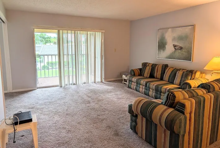 Living room with screened lanai / laundry