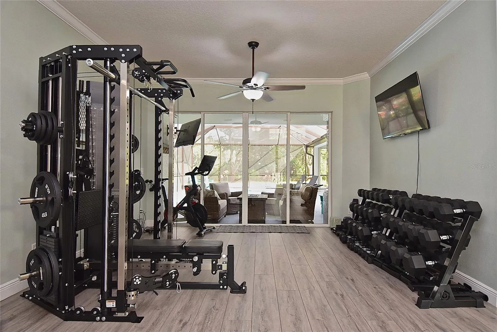 Front living space with gym equipment, original photo
