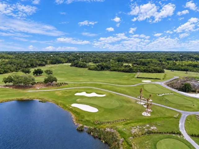 Community lake and golf course, virtually staged, selected golf carts removed