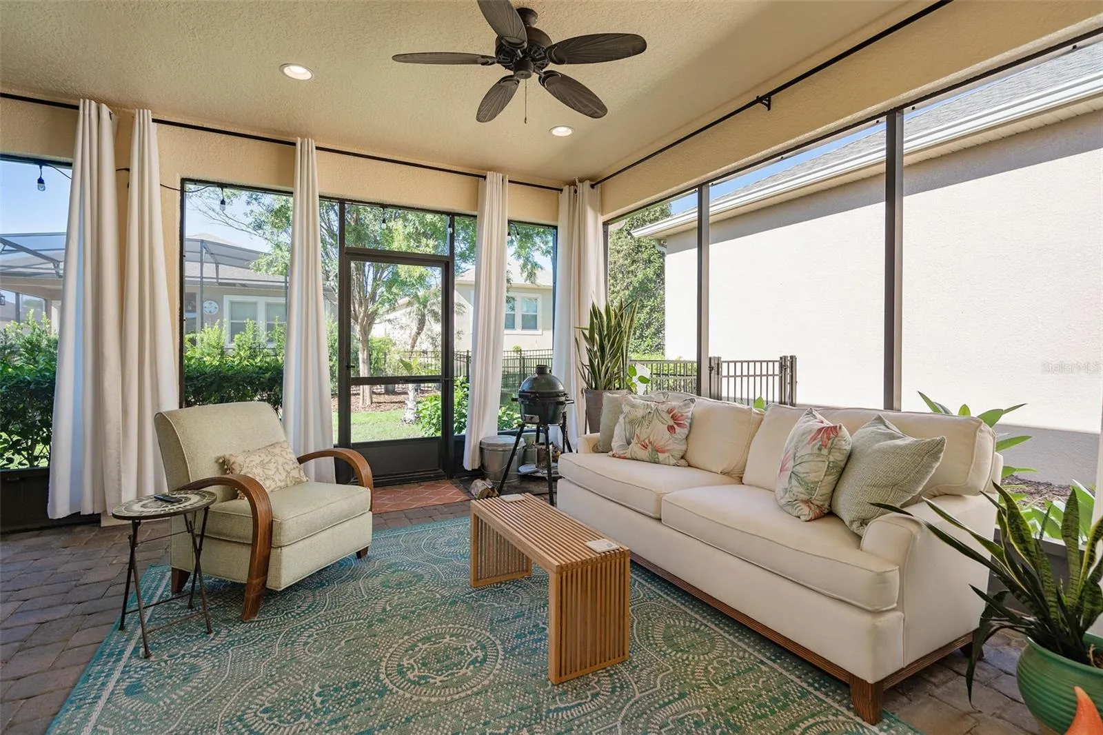 Enjoy the Screened Lanai with 2 Ceiling Fans and Pavers. There is also a Misting System outside for cooling off