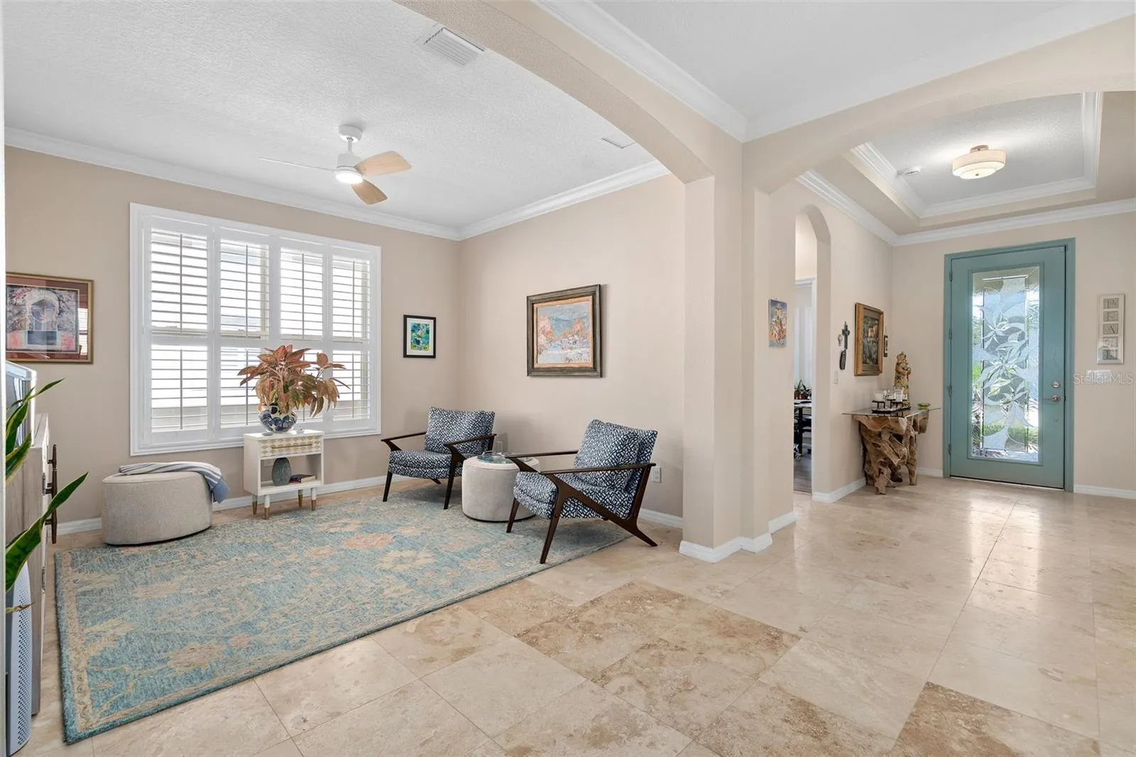 Flex space can be utilized as an Office/Den/Study or a Sitting Room. The Foyer is in the background.