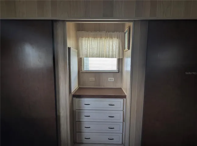 built-in storage and dual closets in master bedroom.