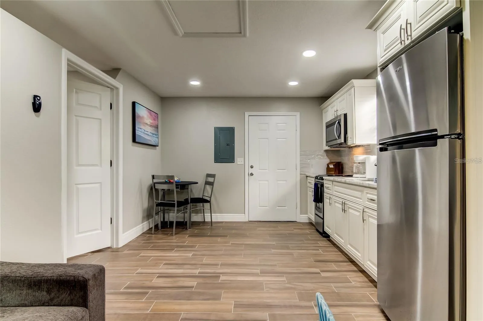 View into kitchen and dining area from living room