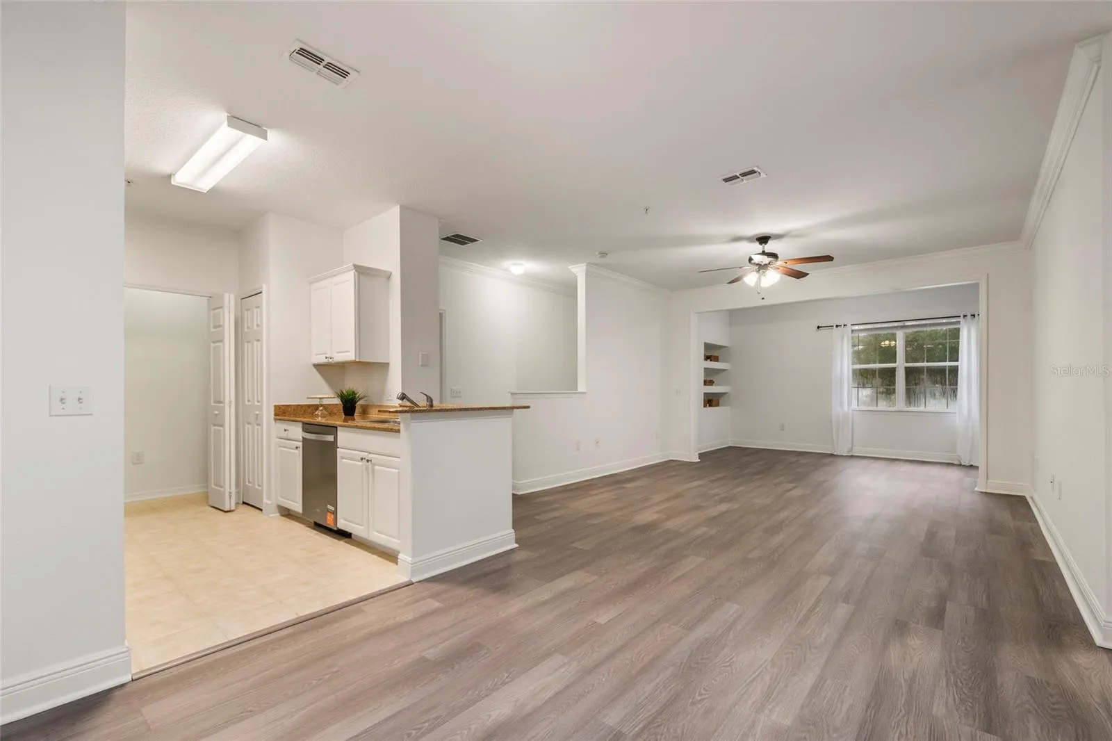 The full view of the expansive combination of Kitchen, dining, family and alcove. Generously sized at 1453 square feet the 3 bedrooms and 2 baths open floor plan is totally move in ready.
