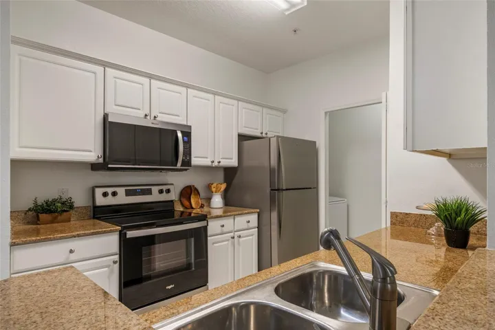 Granite countertops, brand new Microwave and Refrigerator and Dishwasher and the Range is just a few years old.