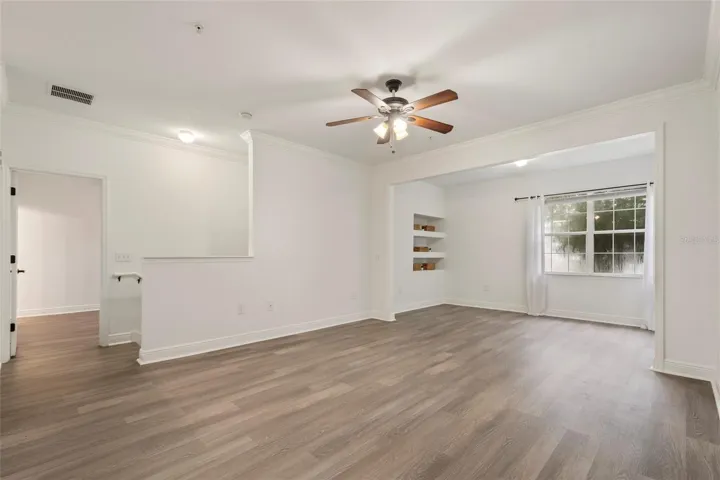 Across the other side of unit is the entrance to the primary suite, the split floor plan allows privacy for the entire family or is a perfect Roomate plan.