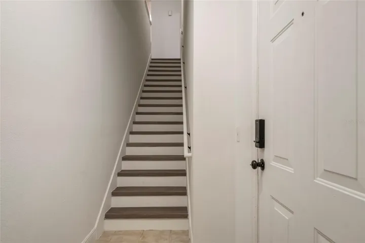 Ascend the stairs and notice the handrail, risers and all interior walls, ceiling and trim are ALL freshly painted.