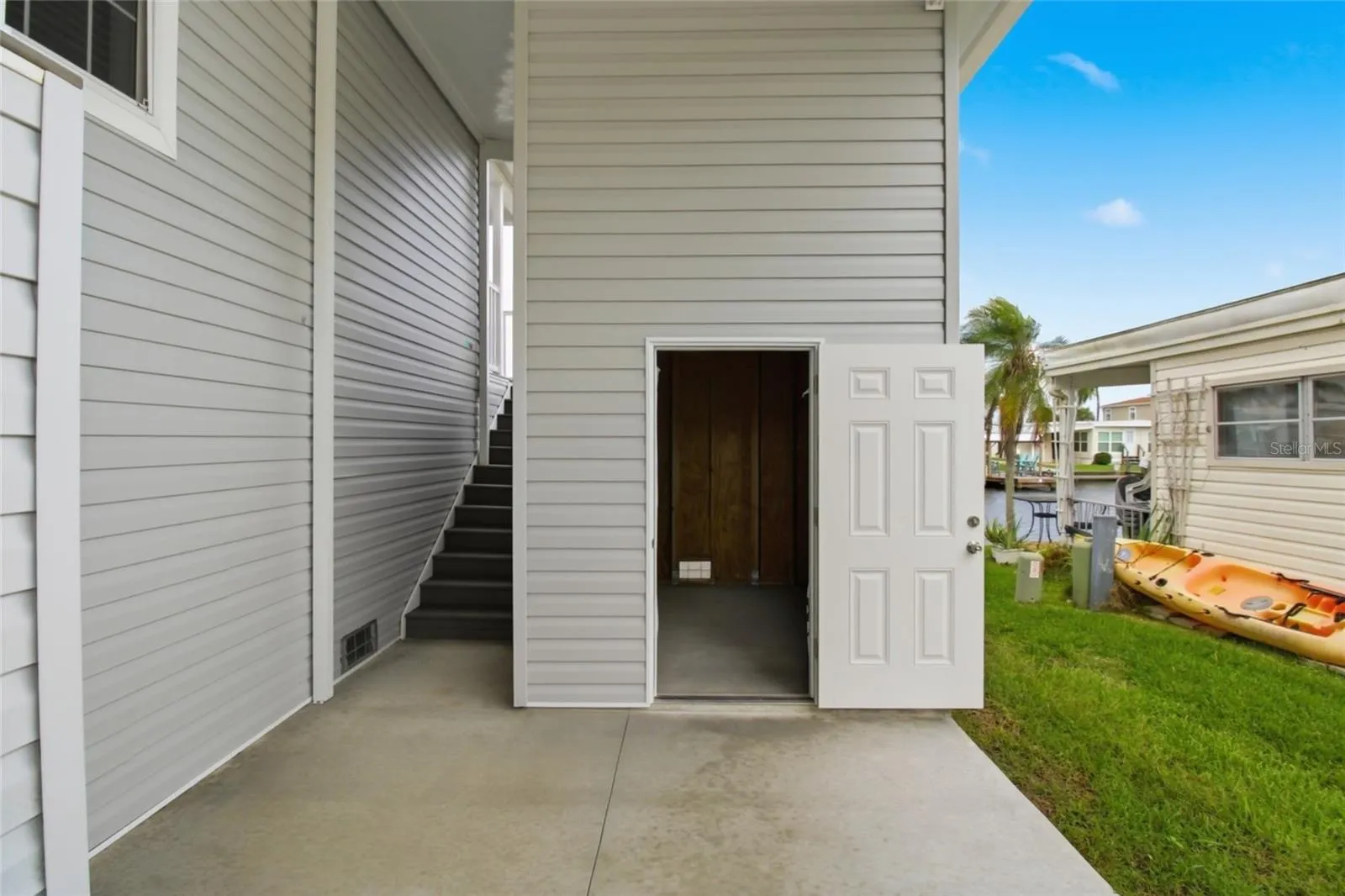 Large Storage Room- Floor to Ceiling and back staircase to back patio and 2nd entrance