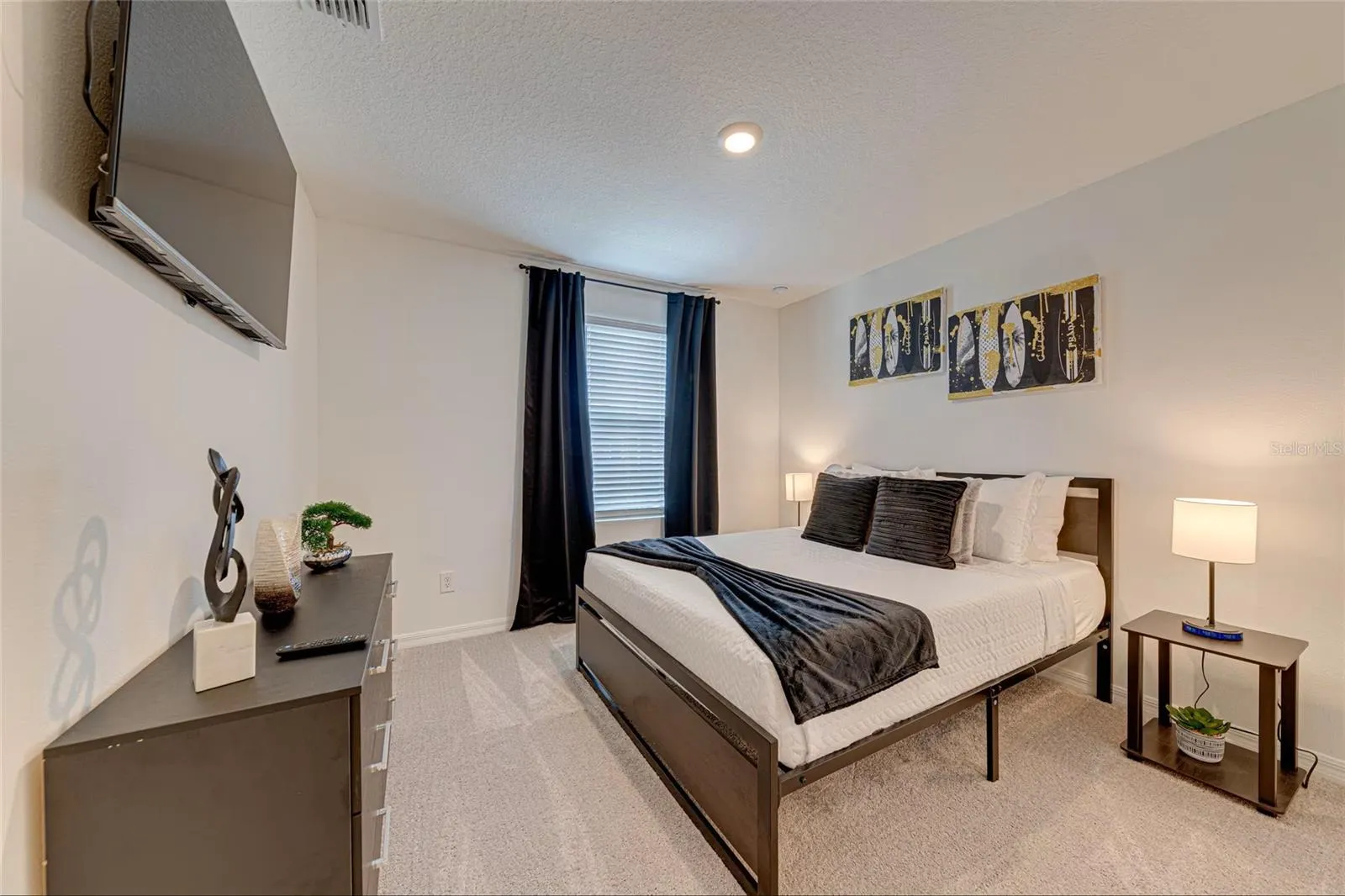 22. Bedroom 6    Well-appointed furnished bedroom with TV, ideal for family members or guests.