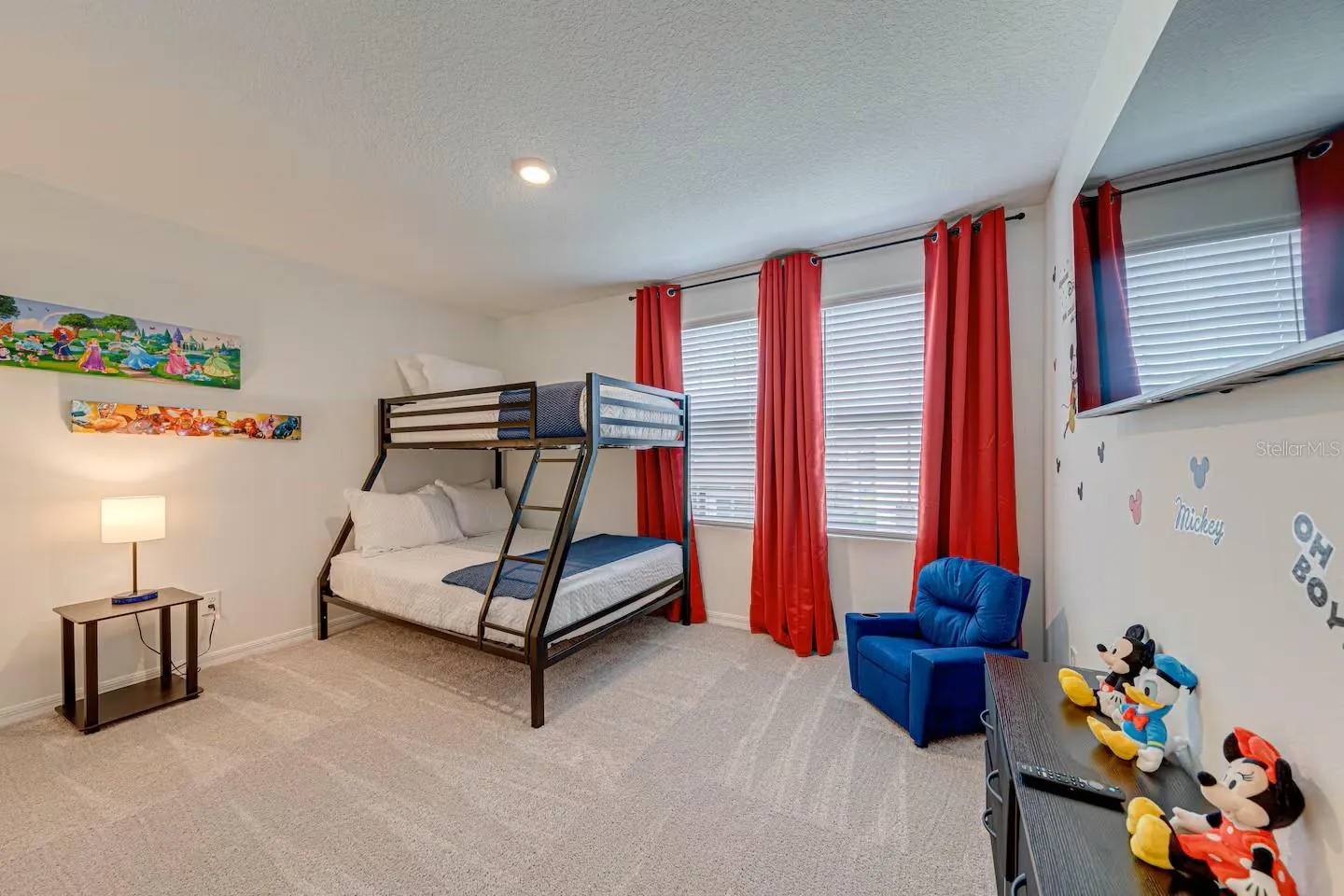 *  Bedroom – Additional View    Bright furnished bedroom with private TV and a modern, comfortable design.