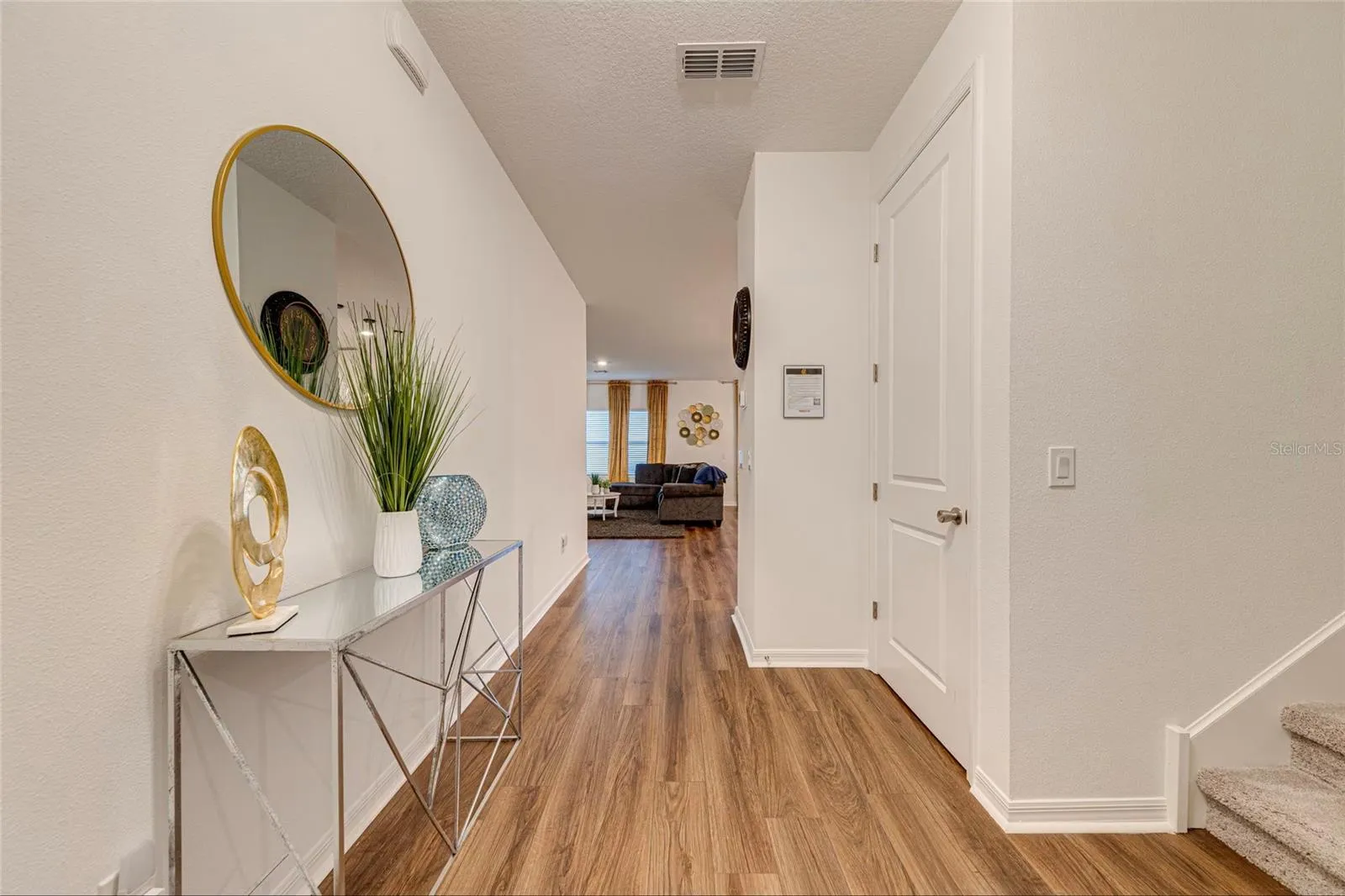 8. Foyer / Entry    Welcoming entry foyer with a bright and modern interior.