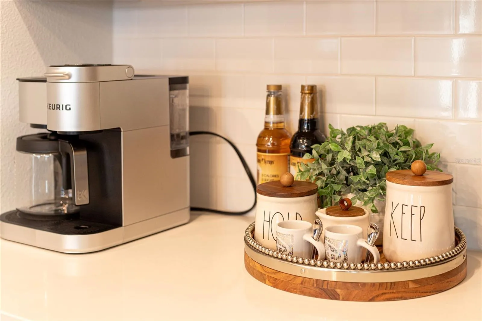 Kitchen Detail    Coffee station and decorative counter space adding warmth and convenience to the kitchen.