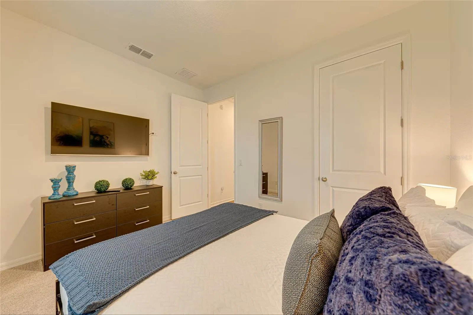 20. Bedroom 4    Bright furnished bedroom with private TV and ample space for guests.