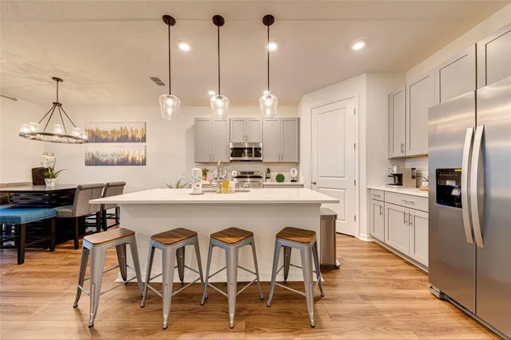 3. Kitchen    Modern kitchen with large center island, ample cabinetry, and generous counter space.