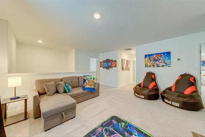 13. Loft    Spacious upstairs loft offering an additional TV lounge and entertainment area.