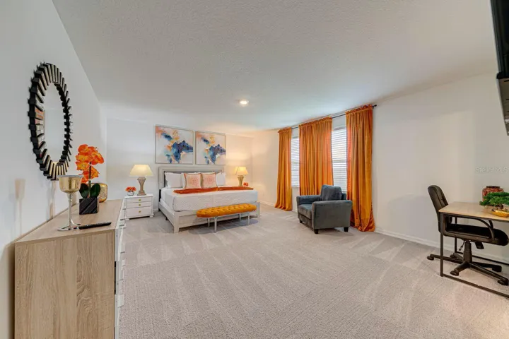 9. Primary Bedroom    Spacious primary bedroom, fully furnished and equipped with a private TV.