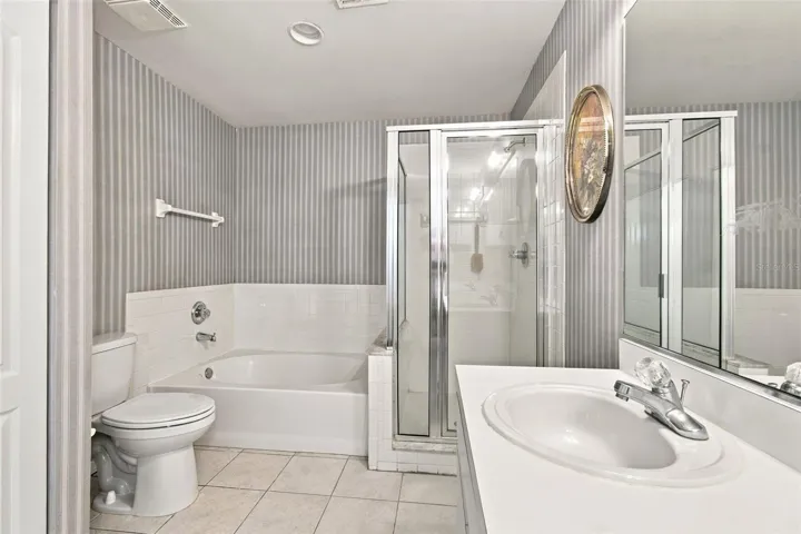 Primary bathroom separate shower, garden tub and dual sinks