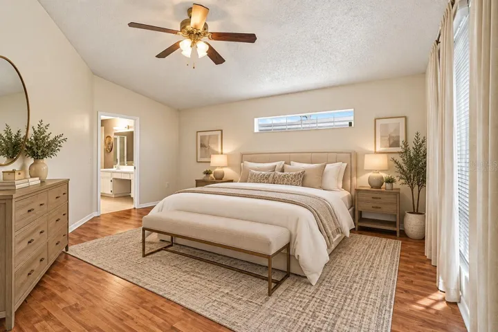 Virtually staged Primary bedroom laminate flooring