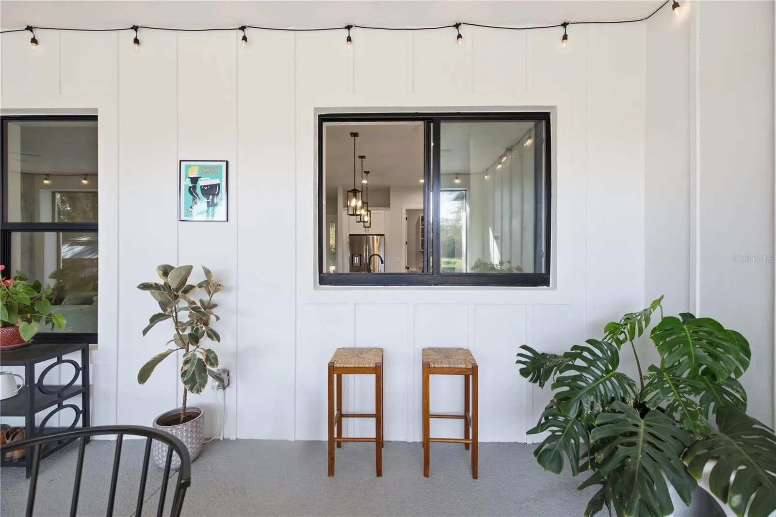 Pass through window from kitchen to rear porch for entertainment nad hosting.