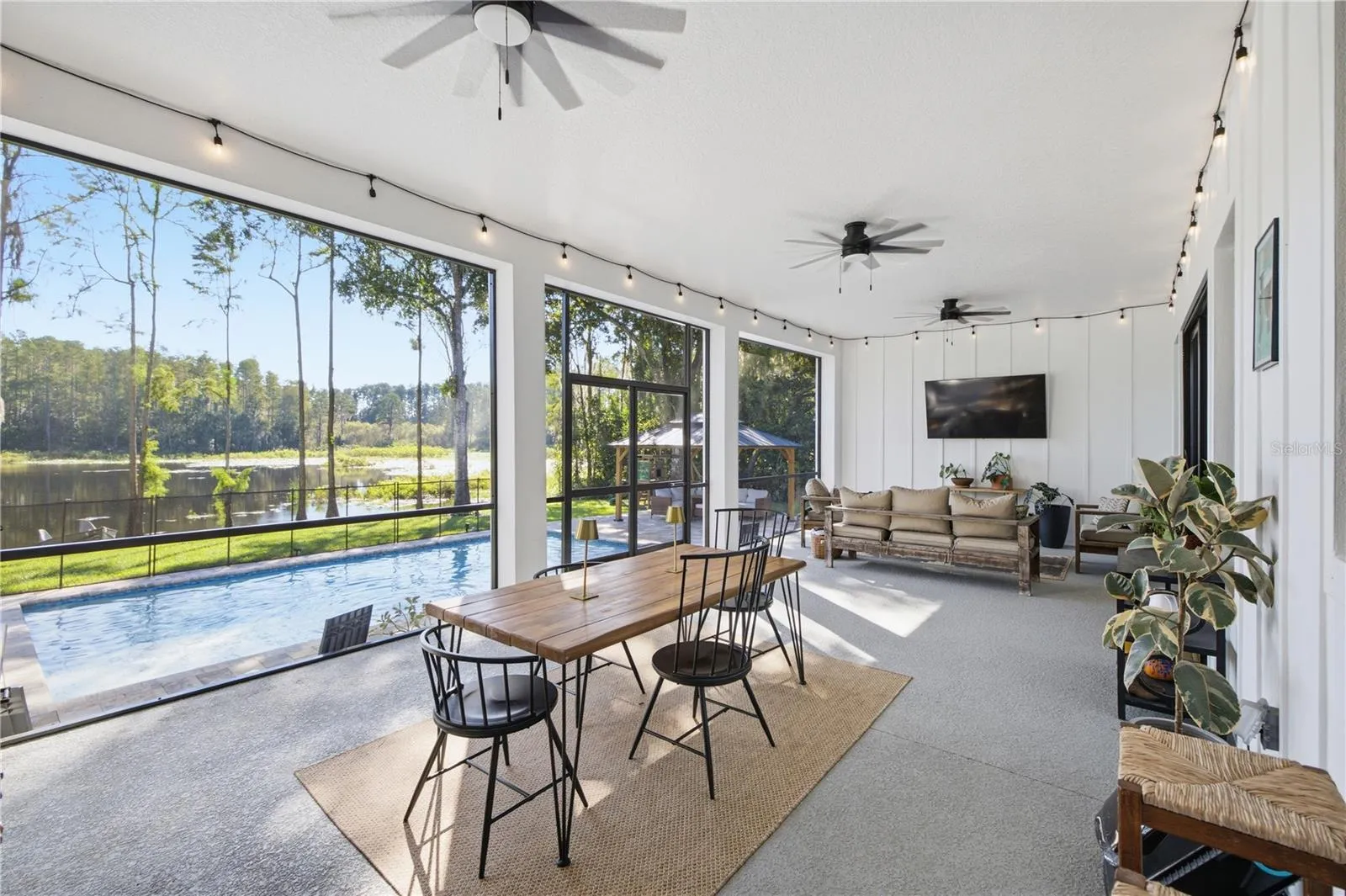 32 FT+ covered, screened, rear porch with TV and fans.